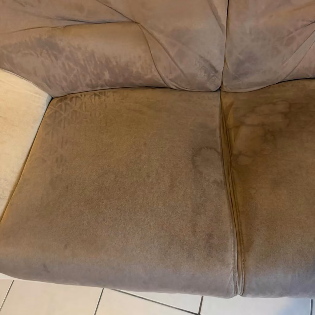 Canapé bicolore · assise gauche avant nettoyage